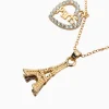 gold-eiffel-tower-necklace-with-heart-pendant-white-stones-detail-roneljake